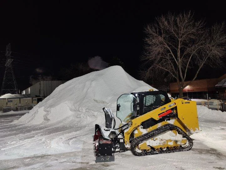 Commercial snow pile removal with skid steer